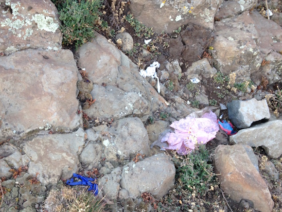 Trash sprinkled around Gich campsite.